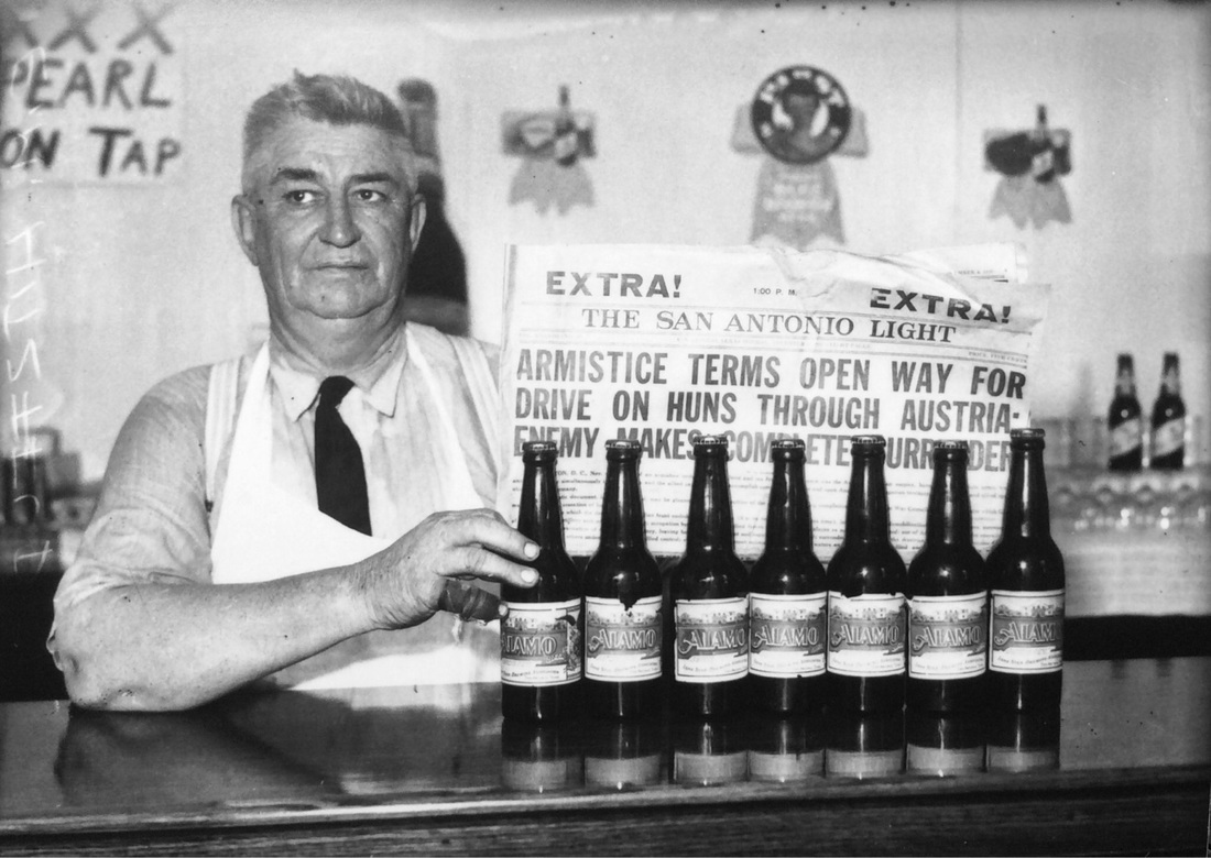 E.M. Hitzfelder pulls old Alamo beer from his storeroom, which was packed in the November 4, 1918 edition San Antonio Light to showcase the legalization of the sale of 3.2% beer September 26, 1933.  By the fourth year of the Great Depression I would imagine that everyone needed a drink. | Drink up the history with The Barwalk, San Antonio TX